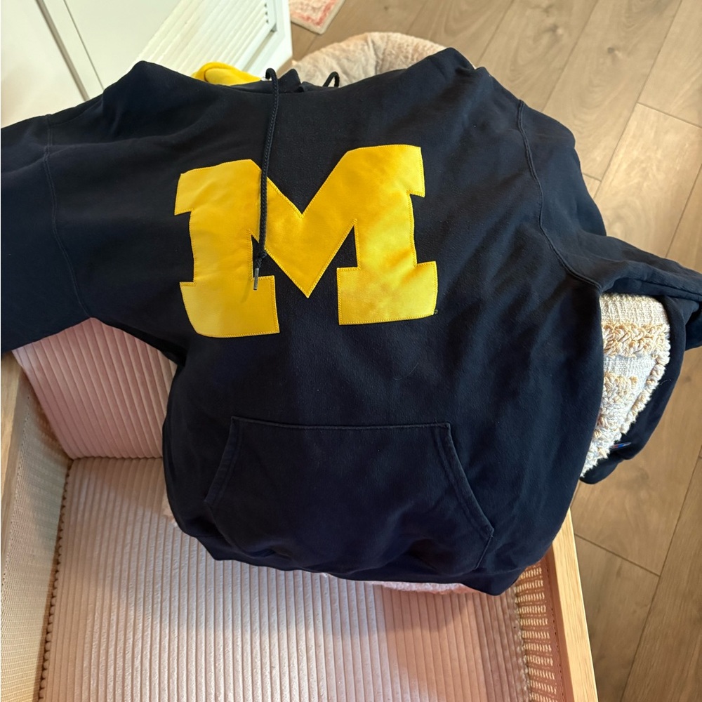 Champion Dark Hoodie with Yellow Accents
